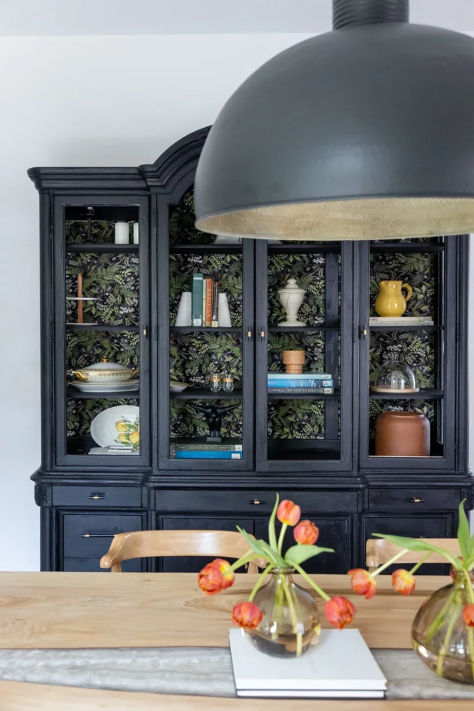 Black glazed hutch with wallpaper backing