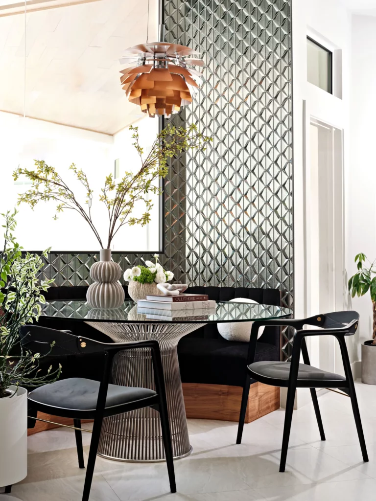 Built-in banquette with mirrored tile wall