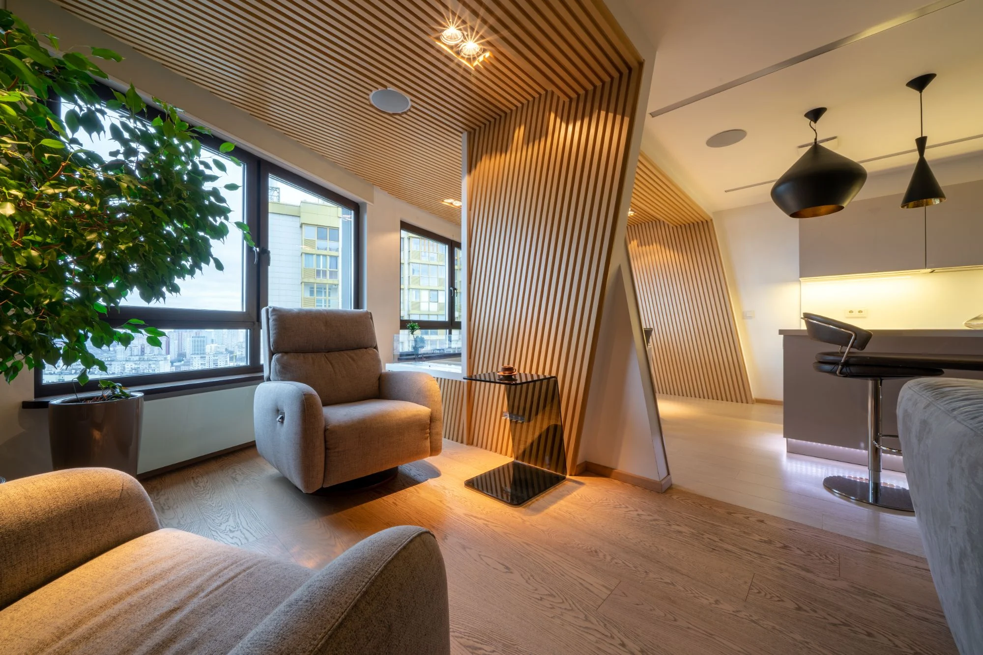 Living space with angled wood slat feature walls and a slatted ceiling